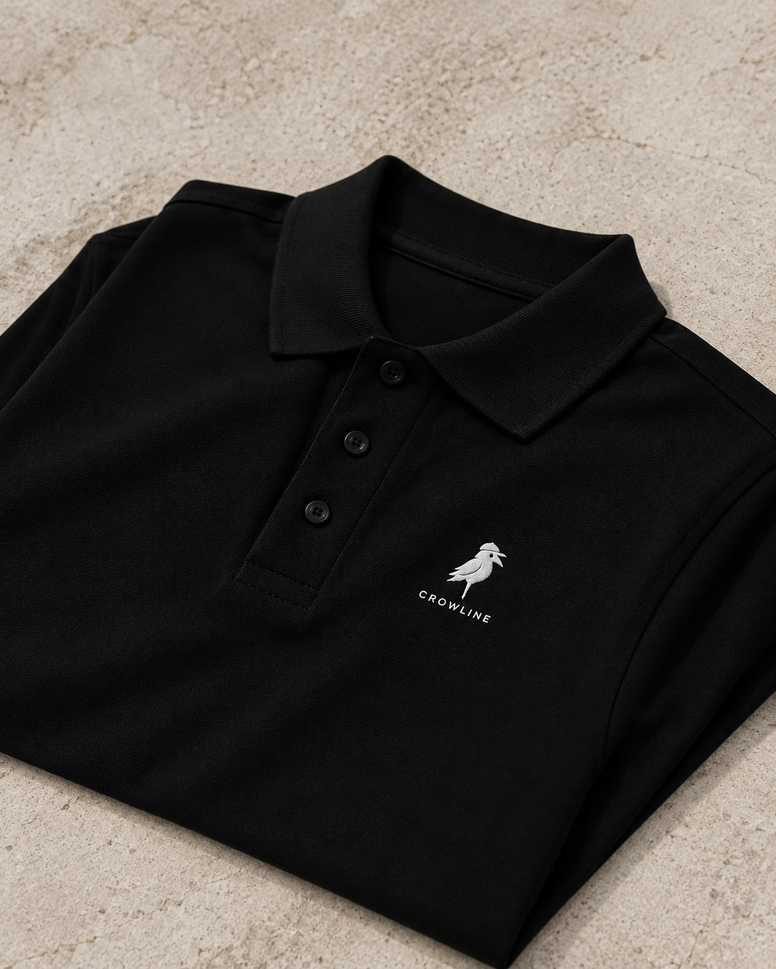 Crow Polo in Black — folded detail